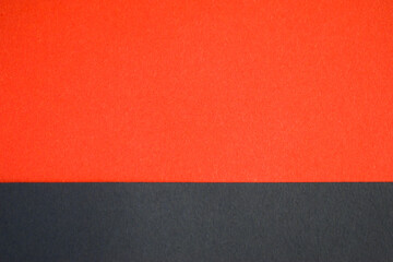 Fototapeta premium Orange and black abstract background divided horizontally