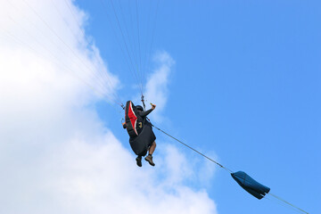 Paraglider being towed on a winch launch	