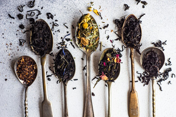 Varieties of tea in vintage spoons
