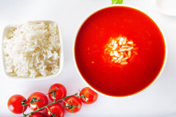 Tomato soup with rice. Healthy food. White background.