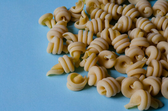 Unprepared insalatonde pasta background.