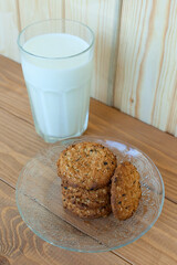 A few stacks of cookies and a glass of fresh milk