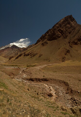 Stream flowing downhill across the desert and mountains. 