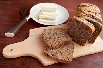 healthy food - fresh bread and feta cheese on a wooden background