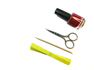 Set for self-care of nails: manicure scissors, a cuticle stick, nail polish and a set of files. The concept of home personal care without visiting a beauty salon. Top view. Space for text or logo.