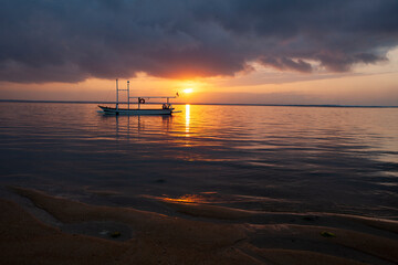 Fototapeta na wymiar sunset beach and boat