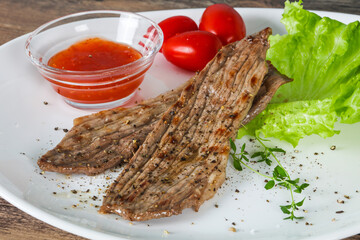 Grilled Thick pork steak served salad