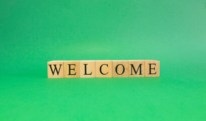Wooden Blocks with the text Welcome. Close up.
