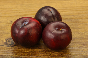 Ripe sweet plum fruit heap