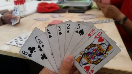close up photo playing cards in a hand