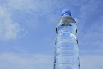 bottle of water with sky background