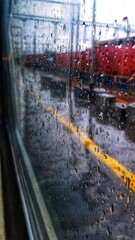 Rain in the city while Travelling in Train