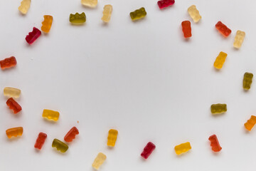 jelly bears on a white table scattered in a circle