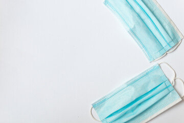 two blue masks on a white table. Virus protection.