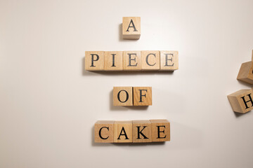 In terms of easy work, A piece of cake. Written from wooden cubes.
