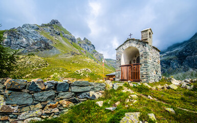 Amazing Alps surronding stone chapel