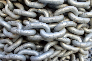 Old industrial chain ropes - the big chains (silver color) close-up