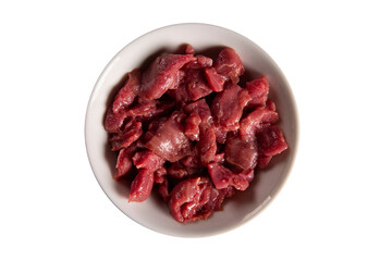 White bowl with meat raw on white background. Top view