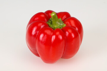 Ripe red bell pepper isolated on white