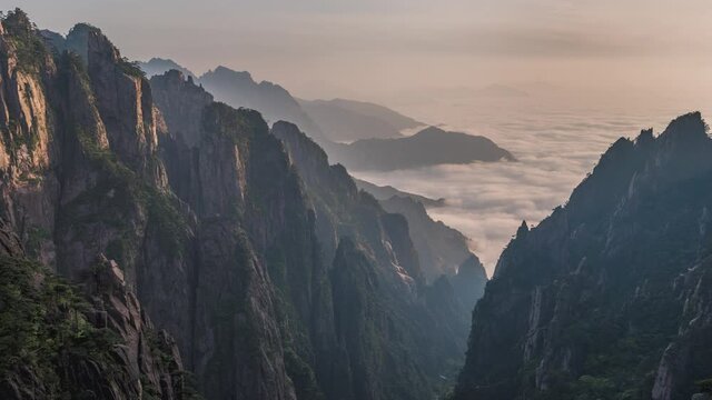 4K, 10BIT, YUV422 timelapse of The Huangshan mountain with clouds sea and pine trees in sunset, Anhui, China