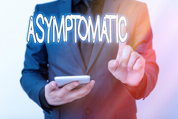 Writing note showing Asymptomatic. Business concept for a condition or an individual producing or...