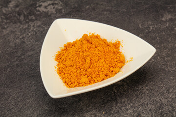 Tumeric powder in the bowl