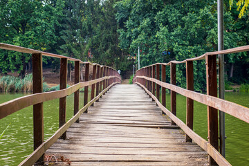 Fototapeta na wymiar Old wooden bridge at Lake Gebart (Gébárti-tó)