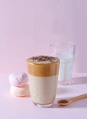 Korean coffee dalgon in high glass on a pink background. Horizontal background, copy space.
