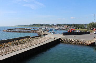 Summer view of the quaint harbour of Spodsbjerg on Langeland from the Lolland ferry. Spodsbjerg is a popular coastal holiday resort in Denmark.