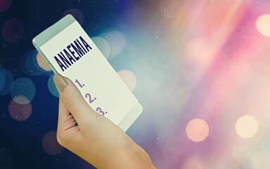 Conceptual hand writing showing Anaemia. Concept meaning a condition marked by a deficiency of...