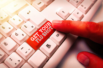 Word writing text Get Your Flu Shot. Business photo showcasing immunization is given yearly to protect against the influenza White pc keyboard with empty note paper above white key copy space