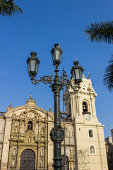 Fototapeta na wymiar LIMA, PERU: View of the ornamental poles and buildings in the main square of the city