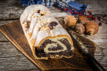 Poppy seed strudel with icing.