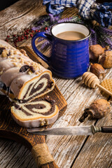 Poppy seed strudel with icing.