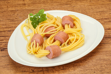 Kids pasta spaghetti with sausages