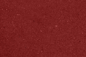The texture of red cardboard. The texture of red paper. Shiny red surface with space for text and design.