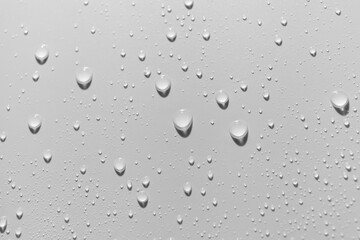 Close up of water drops on white background.