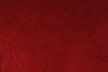 The texture of red leather. Red leather with folds for text and design.