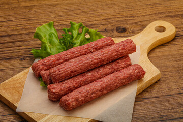 Raw beef sausages with spices