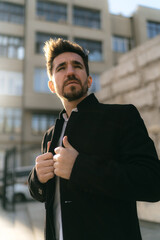 dramatic Close up portrait of a man on the street looking in camera