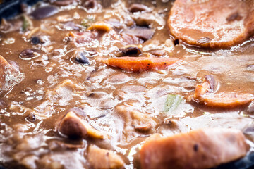 Feijoada mineira, typical food from minas gerais in iron pot.