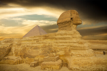 Fototapeta na wymiar The great Sphinx of Giza in a beautiful moody sunset, Cairo, Egypt
