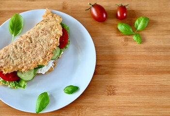 Healthy breakfast food. Sandwich with vegetables on the white plate.