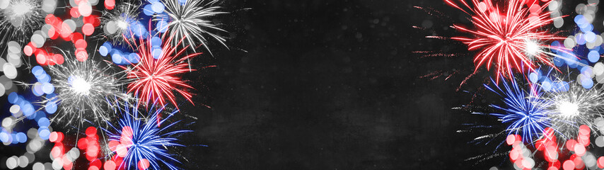 America background panorama - Festive firework and bokeh lights in the colors from the flag from united states of america, isolated on dark blue texture, with space for text