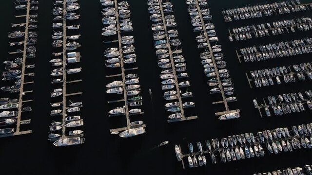 Overhead Aerial of Boats Pulling into Marina Docks to Park