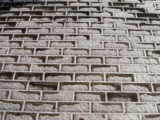 Paving tiles partially covered with snow