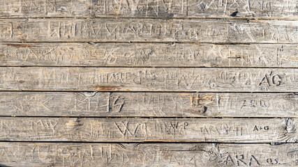 words engraved on a wooden table