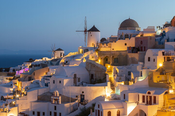View of Oia city at sunrise. City on Santorini island in Greece.