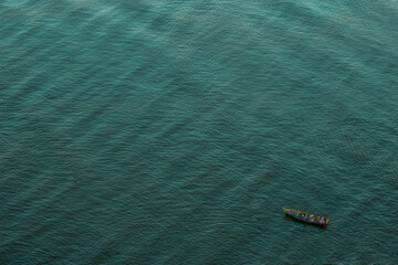 blue water surface whit boat