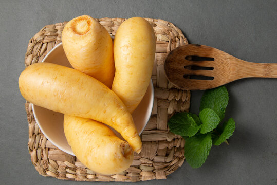 Potato salsa or baroa potatoes in the ceramic bowl. Top view